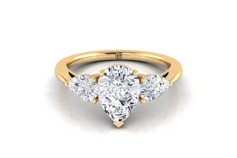 Pear shaped 3 diamonds engagement ring