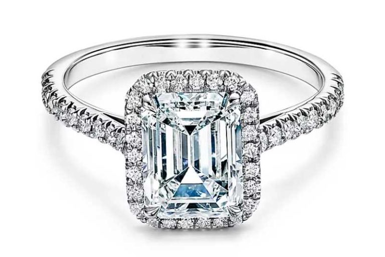 Emerald cut halo engagement ring with a diamond platinum band