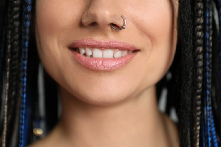 Female model with left nostril ring piercing