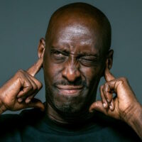 African American man with one eye closed