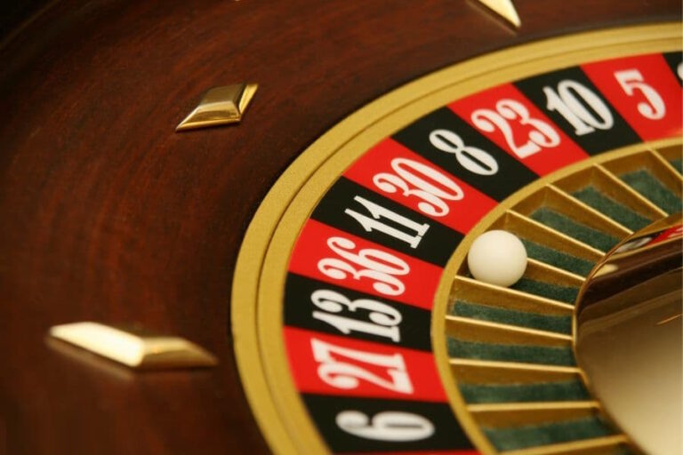 Roulette wheel in casino settles on black number 11 -or