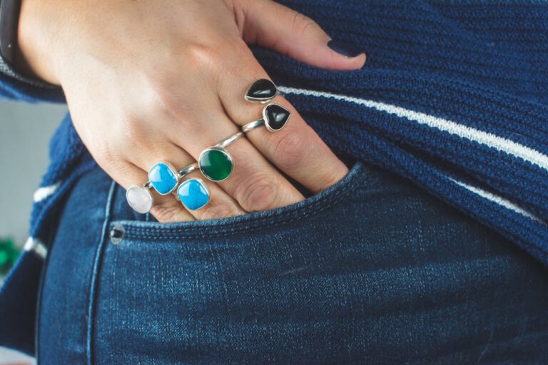 person wearing multiple rings